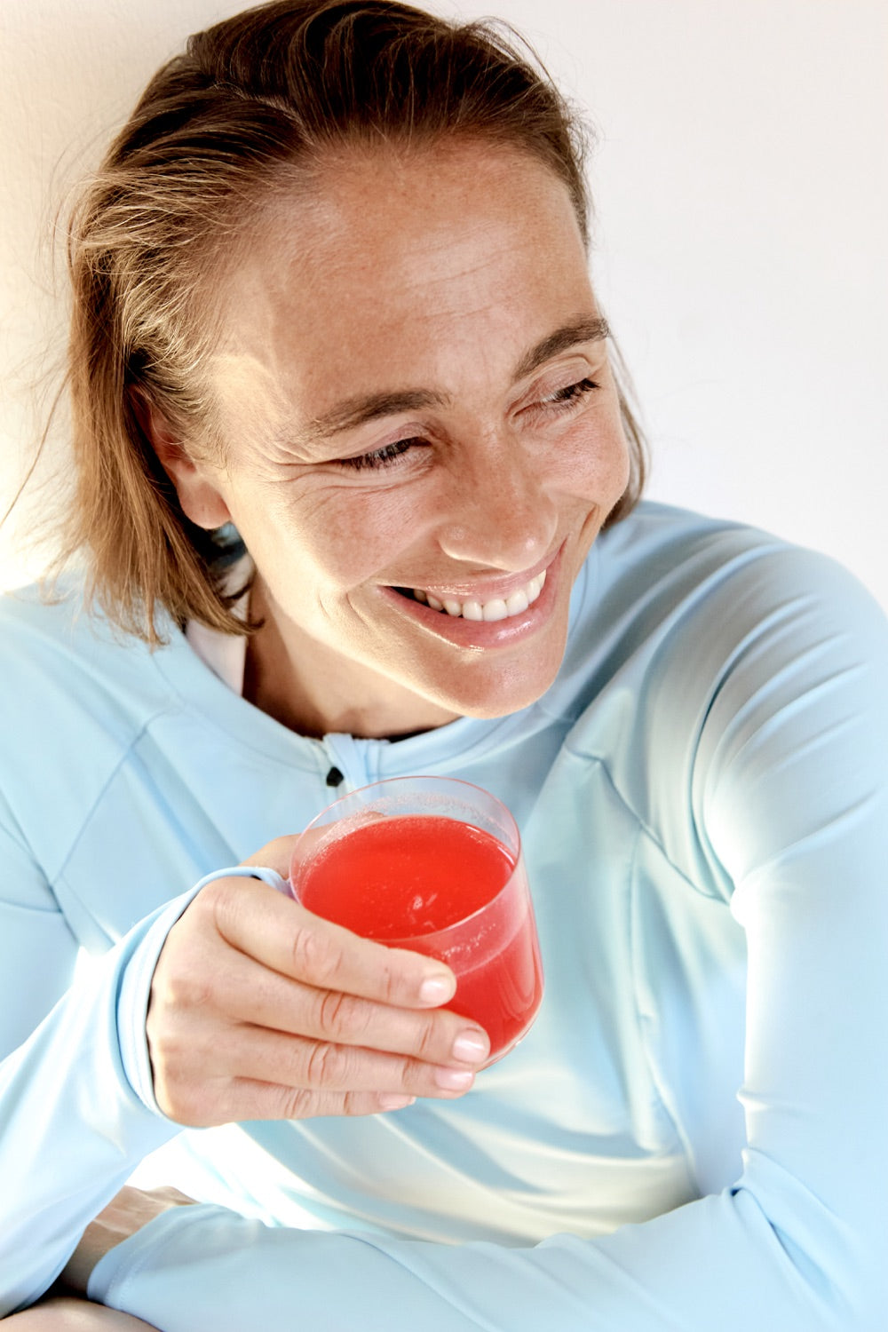 Frau mit einem Glas le melo